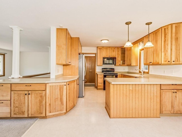 7651 86th St, Bloomington, MN 55438 - kitchen with black appliances, a peninsula, decorative columns, and light countertops
