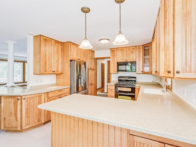 7651 86th St, Bloomington, MN 55438 - kitchen featuring double oven range, black microwave, stainless steel fridge with ice dispenser, a peninsula, and decorative columns