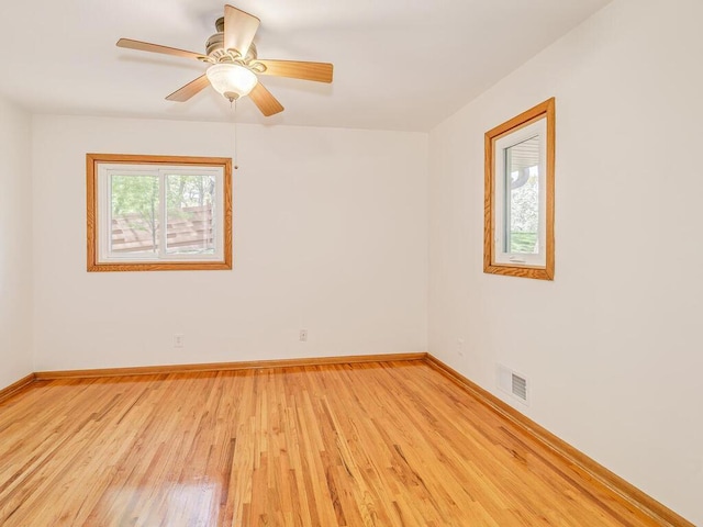 7651 86th St, Bloomington, MN 55438 - spare room with light wood-style flooring and a ceiling fan