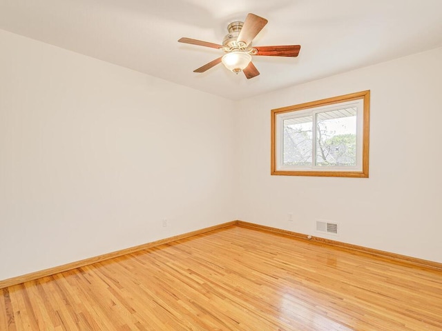 7651 86th St, Bloomington, MN 55438 - empty room featuring light wood finished floors and a ceiling fan