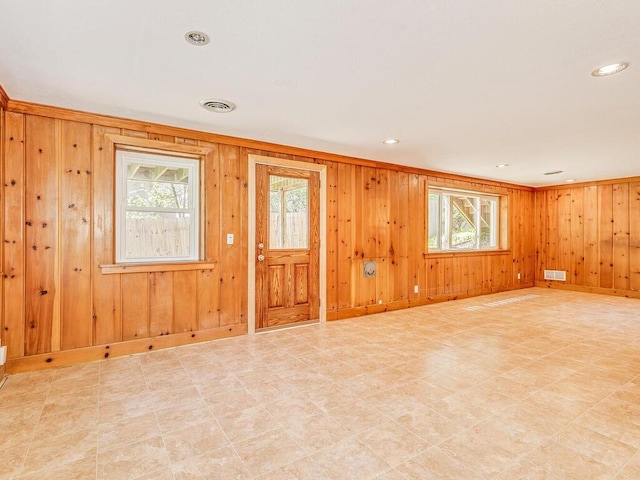7651 86th St, Bloomington, MN 55438 - entrance foyer featuring wooden walls, light floors, and recessed lighting