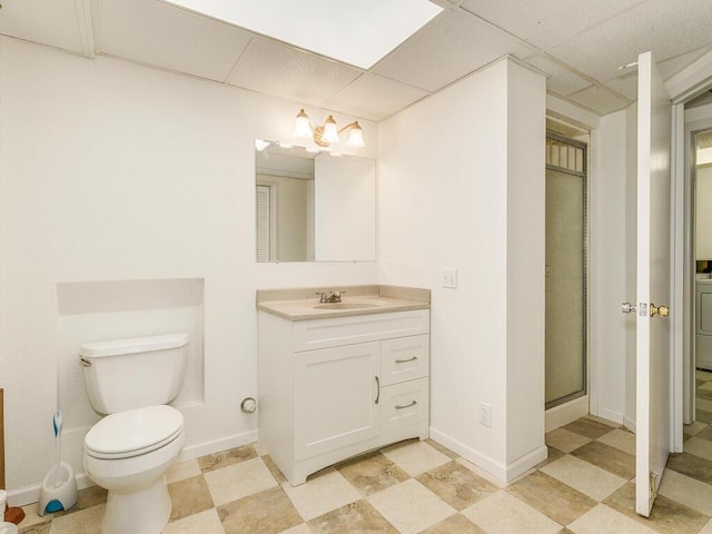 7651 86th St, Bloomington, MN 55438 - bathroom featuring vanity, a drop ceiling, washer / clothes dryer, and a shower with shower door