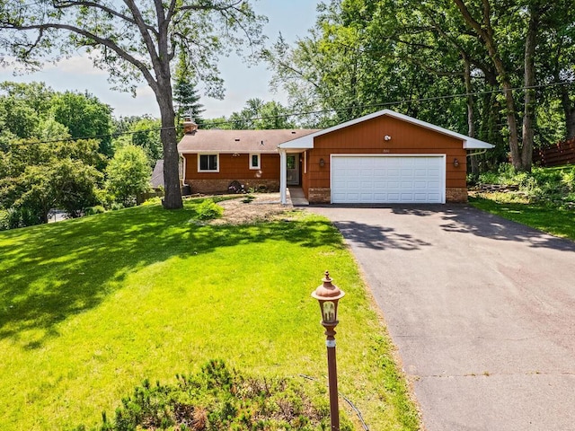 7651 86th St, Bloomington, MN 55438 - ranch-style house with a front yard, a chimney, and driveway