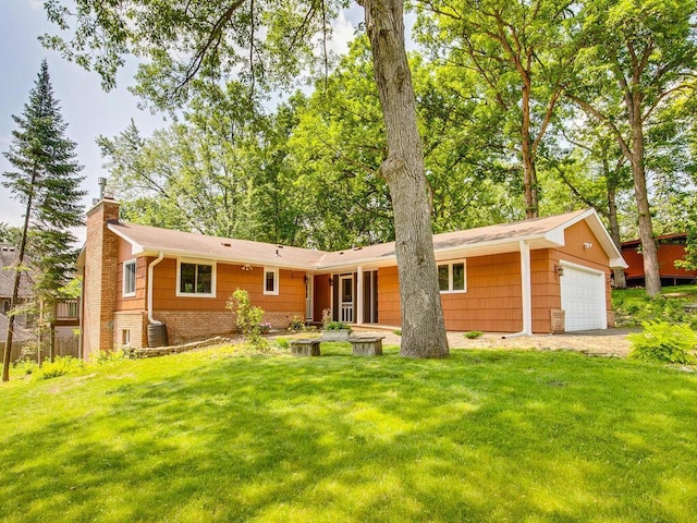 7651 86th St, Bloomington, MN 55438 - rear view of property with a chimney and a lawn