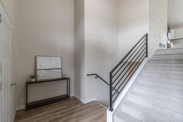 2216 Lake Ave, New Ulm, MN 56073 - staircase featuring wood finished floors and baseboards
