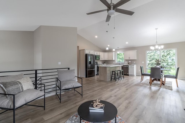2216 Lake Ave, New Ulm, MN 56073 - living area with ceiling fan, a chandelier, light wood-style floors, recessed lighting, and high vaulted ceiling