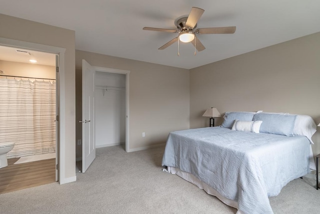 2216 Lake Ave, New Ulm, MN 56073 - bedroom with carpet floors, connected bathroom, ceiling fan, and a closet