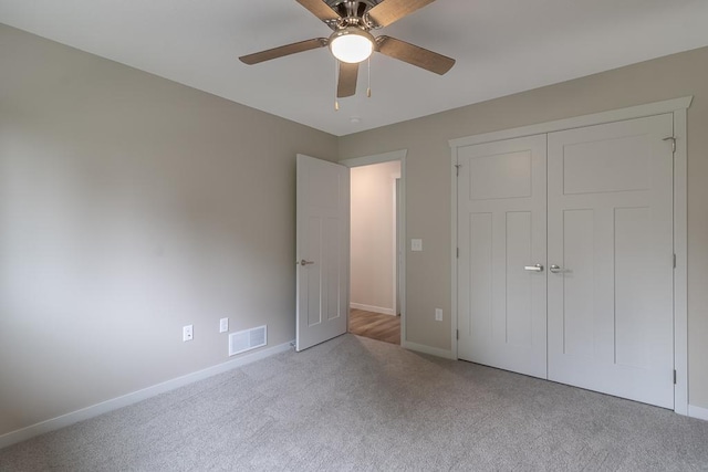 2216 Lake Ave, New Ulm, MN 56073 - unfurnished bedroom featuring carpet, a closet, and a ceiling fan