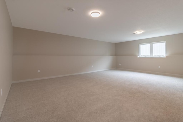 2216 Lake Ave, New Ulm, MN 56073 - spare room featuring light colored carpet and a smoke detector