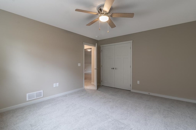 2216 Lake Ave, New Ulm, MN 56073 - unfurnished bedroom featuring light carpet, a closet, and ceiling fan