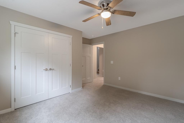 2216 Lake Ave, New Ulm, MN 56073 - unfurnished bedroom with light colored carpet, a closet, and a ceiling fan