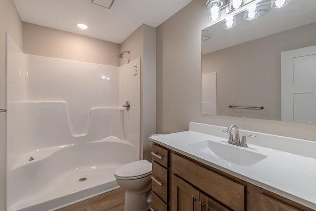 2216 Lake Ave, New Ulm, MN 56073 - bathroom featuring vanity, a shower, and wood finished floors