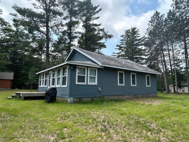29184 Jana Rd, Scott Twp, WI 54830 - view of property exterior with a lawn and a shed