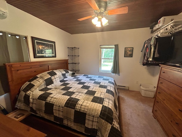 29184 Jana Rd, Scott Twp, WI 54830 - carpeted bedroom with a baseboard heating unit, an AC wall unit, a ceiling fan, and wooden ceiling