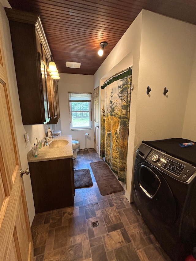 29184 Jana Rd, Scott Twp, WI 54830 - washroom featuring washer / dryer, stone tile floors, and wooden ceiling
