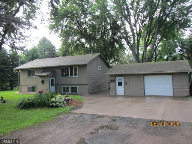 10445 215th Street Ct N, Scandia, MN 55073 - view of front of home featuring an outdoor structure, driveway, a front yard, a detached garage, and roof with shingles