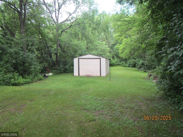 10445 215th Street Ct N, Scandia, MN 55073 - view of green lawn featuring an outbuilding and a view of trees