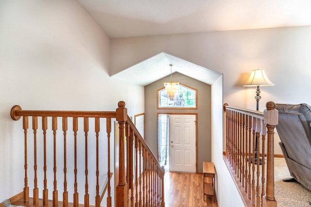152 17th Ave W, West Fargo, ND 58078 - entryway with a chandelier, wood finished floors, and lofted ceiling