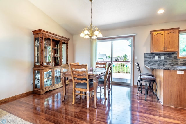 152 17th Ave W, West Fargo, ND 58078 - dining room with a chandelier, dark wood finished floors, recessed lighting, and lofted ceiling