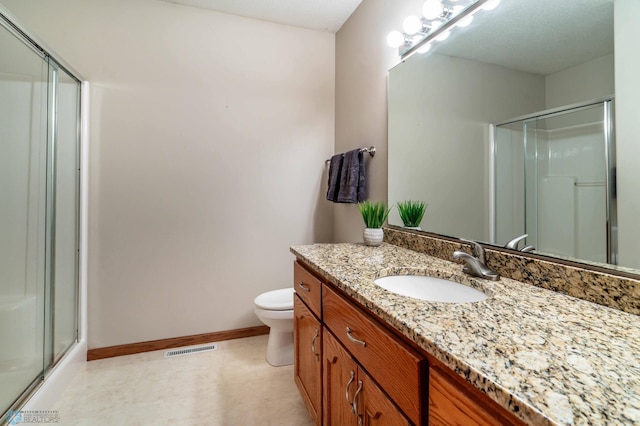 152 17th Ave W, West Fargo, ND 58078 - bathroom with a shower with door, vanity, and tile patterned floors