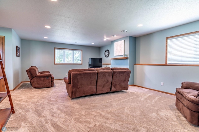 152 17th Ave W, West Fargo, ND 58078 - carpeted living room featuring a textured ceiling and recessed lighting