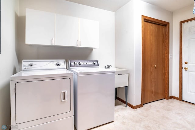 152 17th Ave W, West Fargo, ND 58078 - laundry area with cabinet space and washing machine and clothes dryer