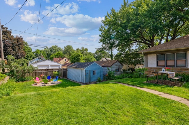 1215 Palace Ave, Saint Paul, MN 55105 - view of yard featuring an outdoor fire pit, a storage shed, and a patio area