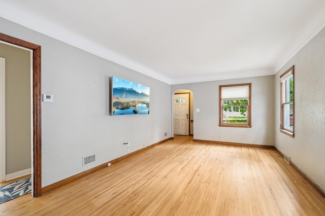 1215 Palace Ave, Saint Paul, MN 55105 - spare room with arched walkways and light wood-type flooring