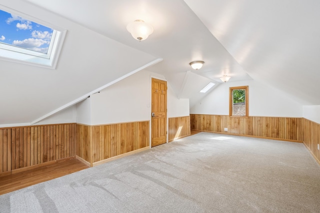 1215 Palace Ave, Saint Paul, MN 55105 - bonus room featuring a wainscoted wall, lofted ceiling, carpet floors, a skylight, and wooden walls