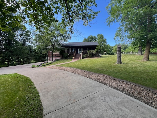 3170 Stark Rd, Fish Lake Twp, MN 55032 - view of front of home featuring a porch, a front yard, and driveway