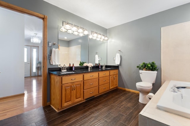 3170 Stark Rd, Fish Lake Twp, MN 55032 - bathroom with double vanity, wood finished floors, and a garden tub