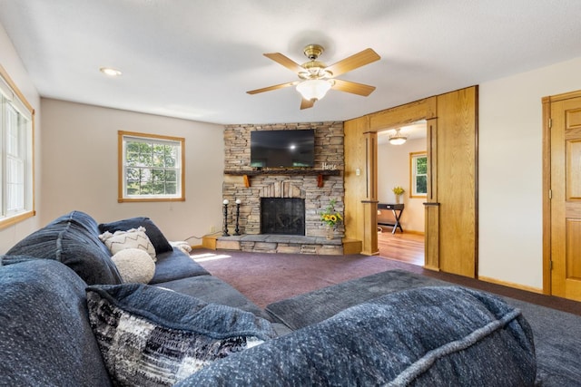 3170 Stark Rd, Fish Lake Twp, MN 55032 - carpeted living area with ceiling fan and a stone fireplace