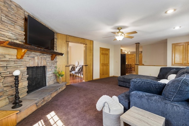 3170 Stark Rd, Fish Lake Twp, MN 55032 - living area featuring carpet floors, a ceiling fan, and a stone fireplace