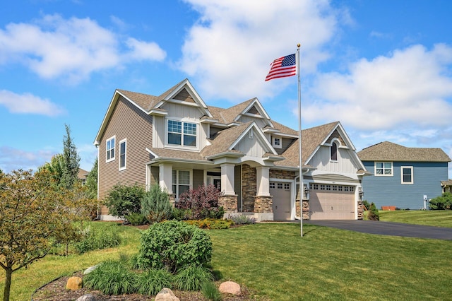 9871 7th St N, Lake Elmo, MN 55042 - craftsman house with board and batten siding, asphalt driveway, and a front lawn