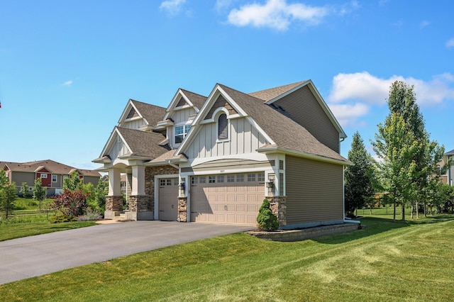 9871 7th St N, Lake Elmo, MN 55042 - craftsman-style home with board and batten siding, driveway, a garage, a front lawn, and roof with shingles