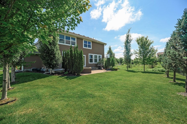 9871 7th St N, Lake Elmo, MN 55042 - view of grassy yard with a patio area