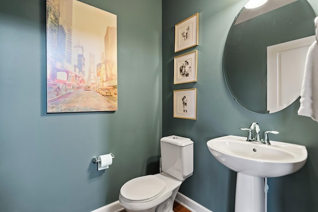 9871 7th St N, Lake Elmo, MN 55042 - half bathroom featuring toilet and baseboards