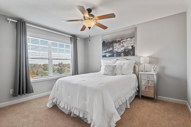 9871 7th St N, Lake Elmo, MN 55042 - carpeted bedroom with baseboards and ceiling fan