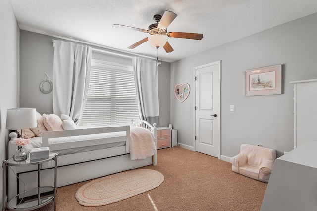 9871 7th St N, Lake Elmo, MN 55042 - bedroom with carpet floors, ceiling fan, and a textured ceiling