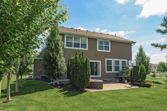 9871 7th St N, Lake Elmo, MN 55042 - rear view of property with a patio area and a yard