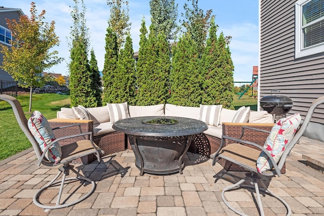 9871 7th St N, Lake Elmo, MN 55042 - view of patio with an outdoor living space with a fire pit