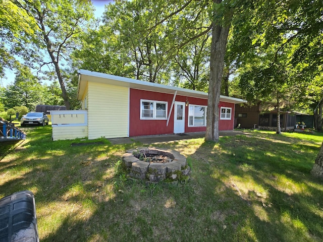 43585 Hidden Trl, Ottertail, MN 56571 - view of front of property featuring an outdoor fire pit and a front yard