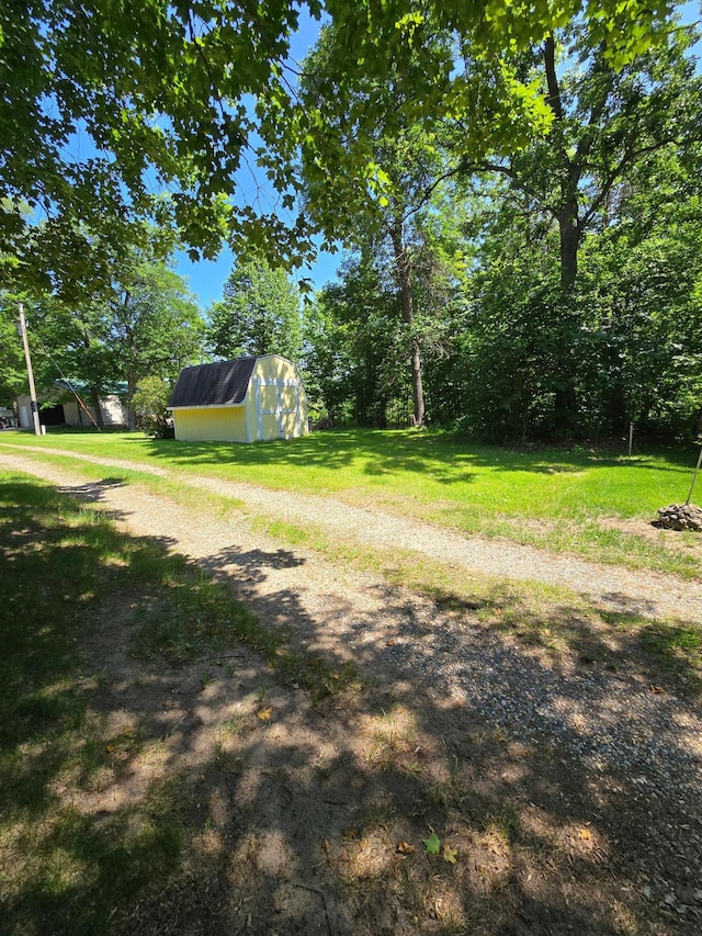 43585 Hidden Trl, Ottertail, MN 56571 - view of green lawn featuring a storage shed