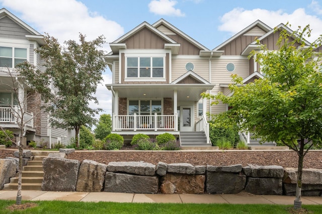 677 Sandstone Cir, Orono, MN 55356 - view of front of property with board and batten siding, stairs, and a porch
