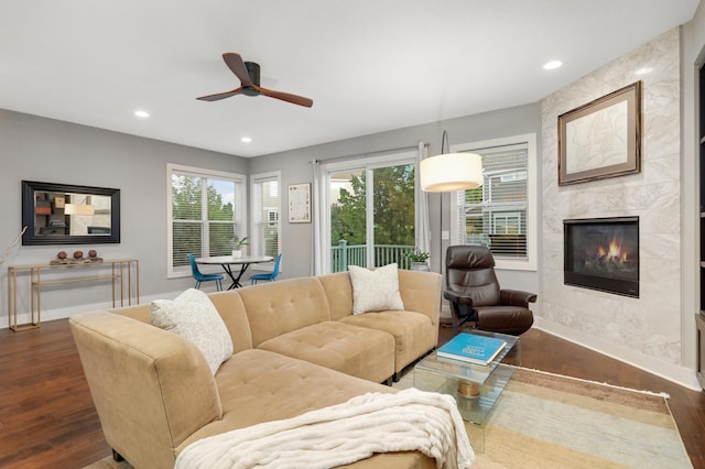 677 Sandstone Cir, Orono, MN 55356 - living room with dark wood-style floors, a fireplace, a ceiling fan, and recessed lighting