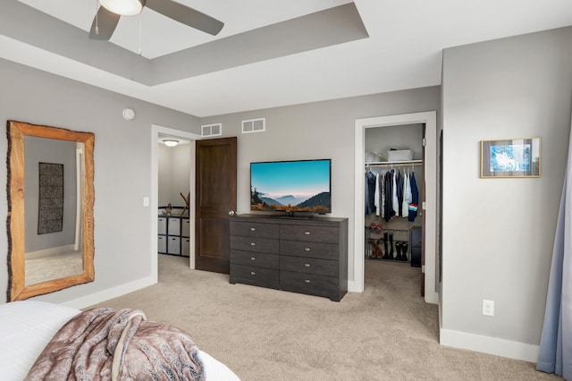677 Sandstone Cir, Orono, MN 55356 - bedroom with light colored carpet, a spacious closet, a closet, and ceiling fan
