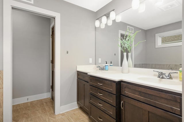 677 Sandstone Cir, Orono, MN 55356 - bathroom featuring double vanity and baseboards