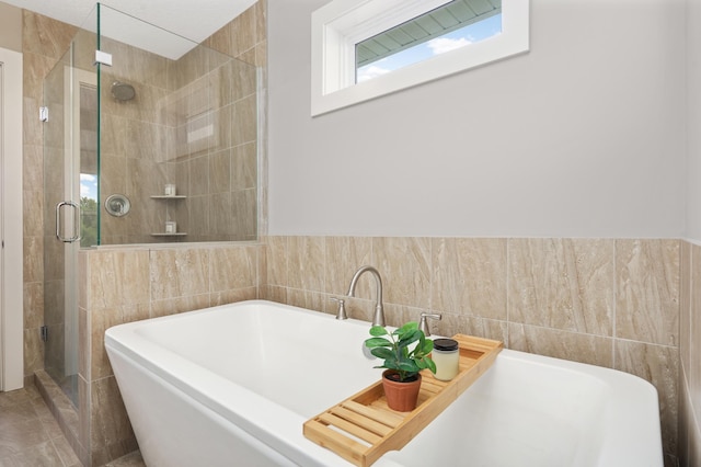 677 Sandstone Cir, Orono, MN 55356 - bathroom with a soaking tub, tile walls, and a shower stall