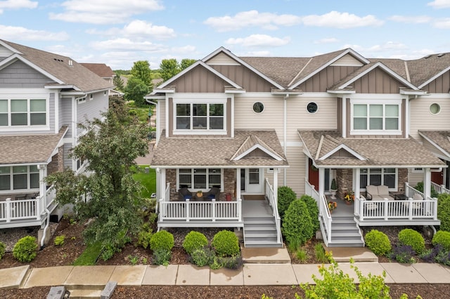677 Sandstone Cir, Orono, MN 55356 - view of front of home featuring board and batten siding, a porch, and a shingled roof