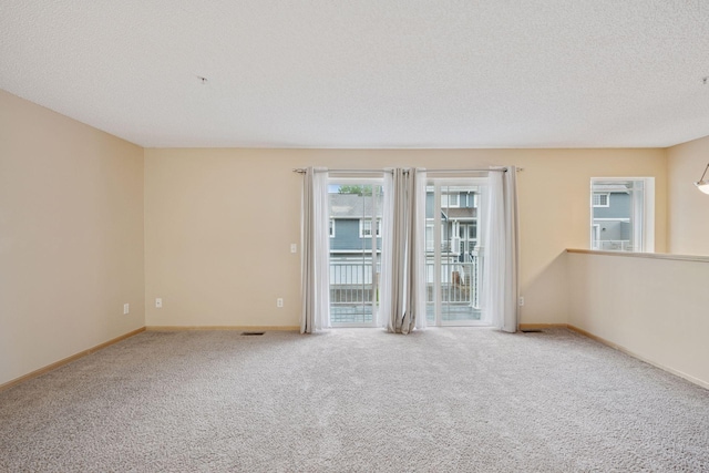 17641 69th Pl N, Maple Grove, MN 55311 - empty room with carpet floors and a textured ceiling